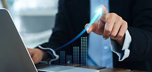 Increasing arrow, the exponential curve of progress in business performance over charts on laptop